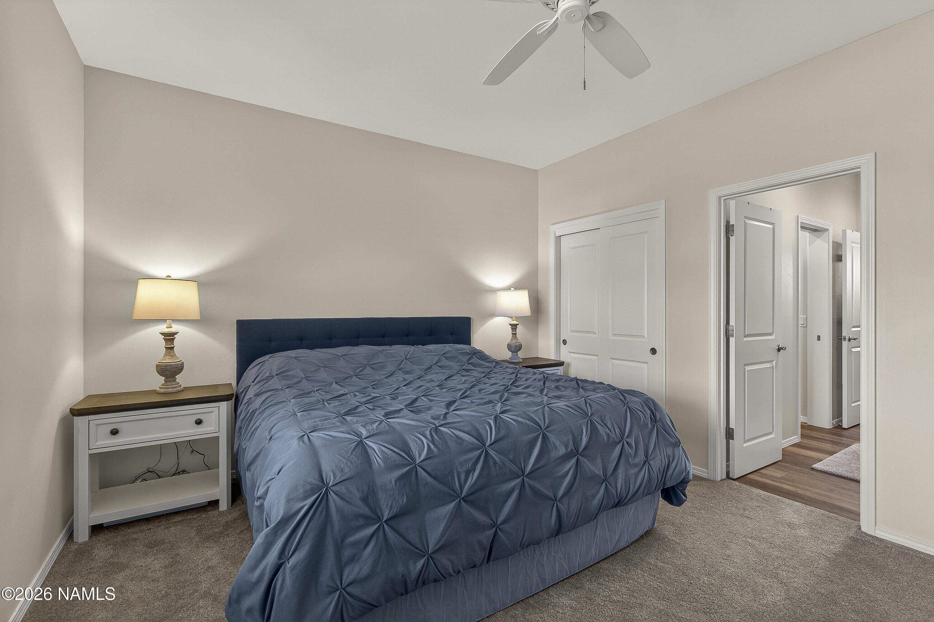 6560 Johnson Ranch Road Flagstaff, AZ 86004 - Photo 26 of 57 a bedroom with a bed and a night stand