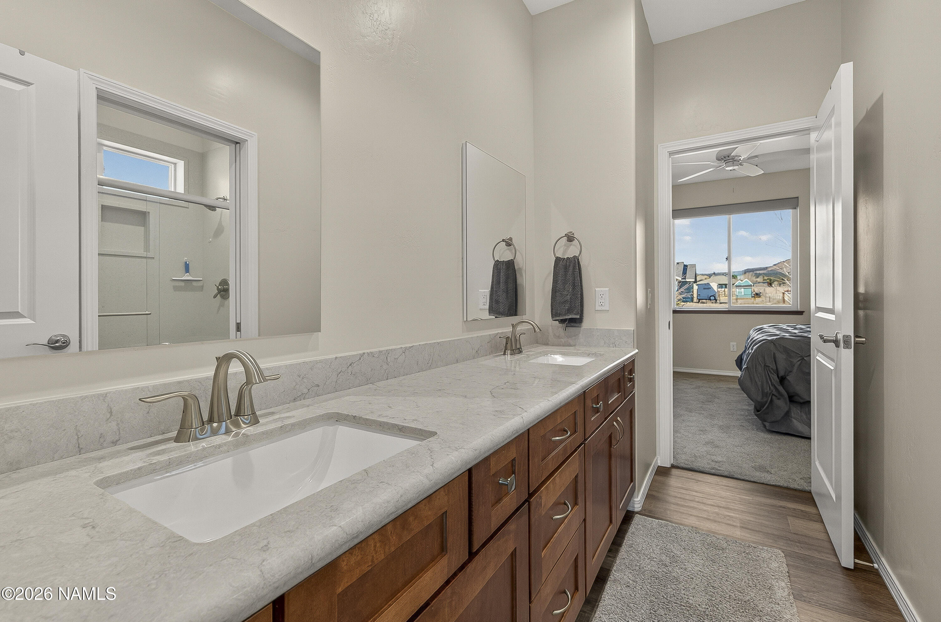 6560 Johnson Ranch Road Flagstaff, AZ 86004 - Photo 28 of 57 a bathroom with a sink and a mirror