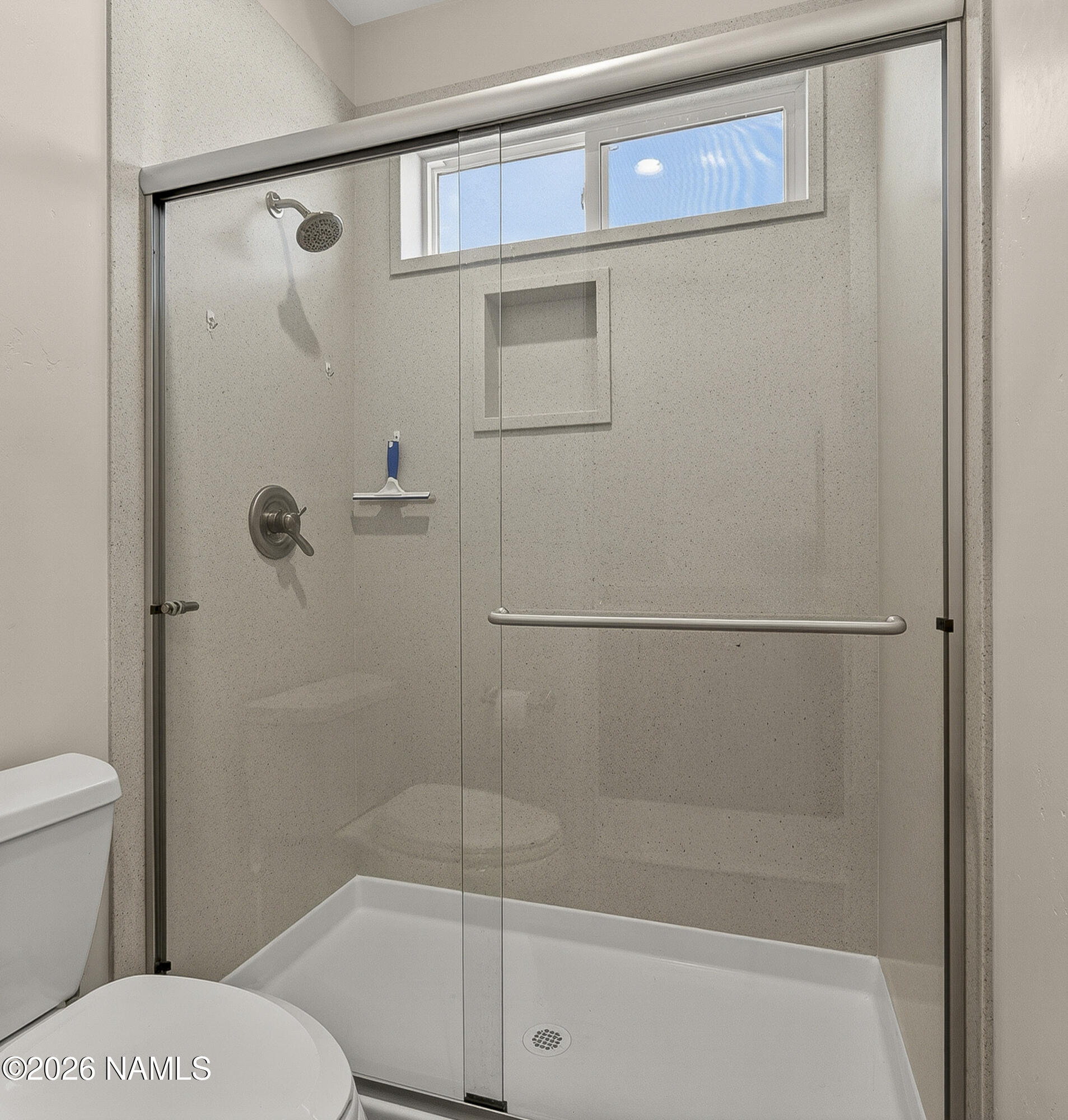 6560 Johnson Ranch Road Flagstaff, AZ 86004 - Photo 30 of 57 a bathroom with a shower and a toilet