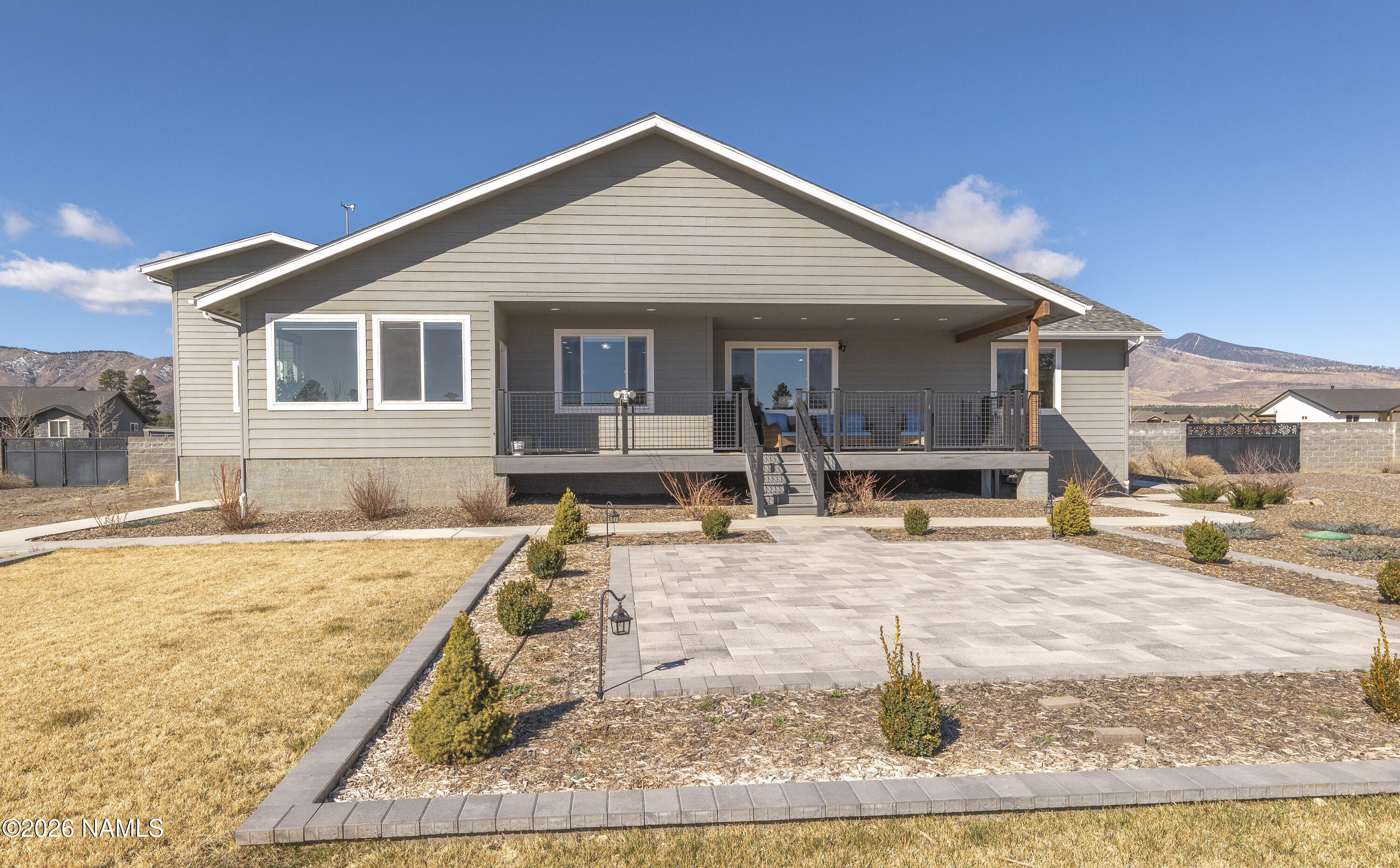 6560 Johnson Ranch Road Flagstaff, AZ 86004 - Photo 39 of 57 a front view of a house with yard