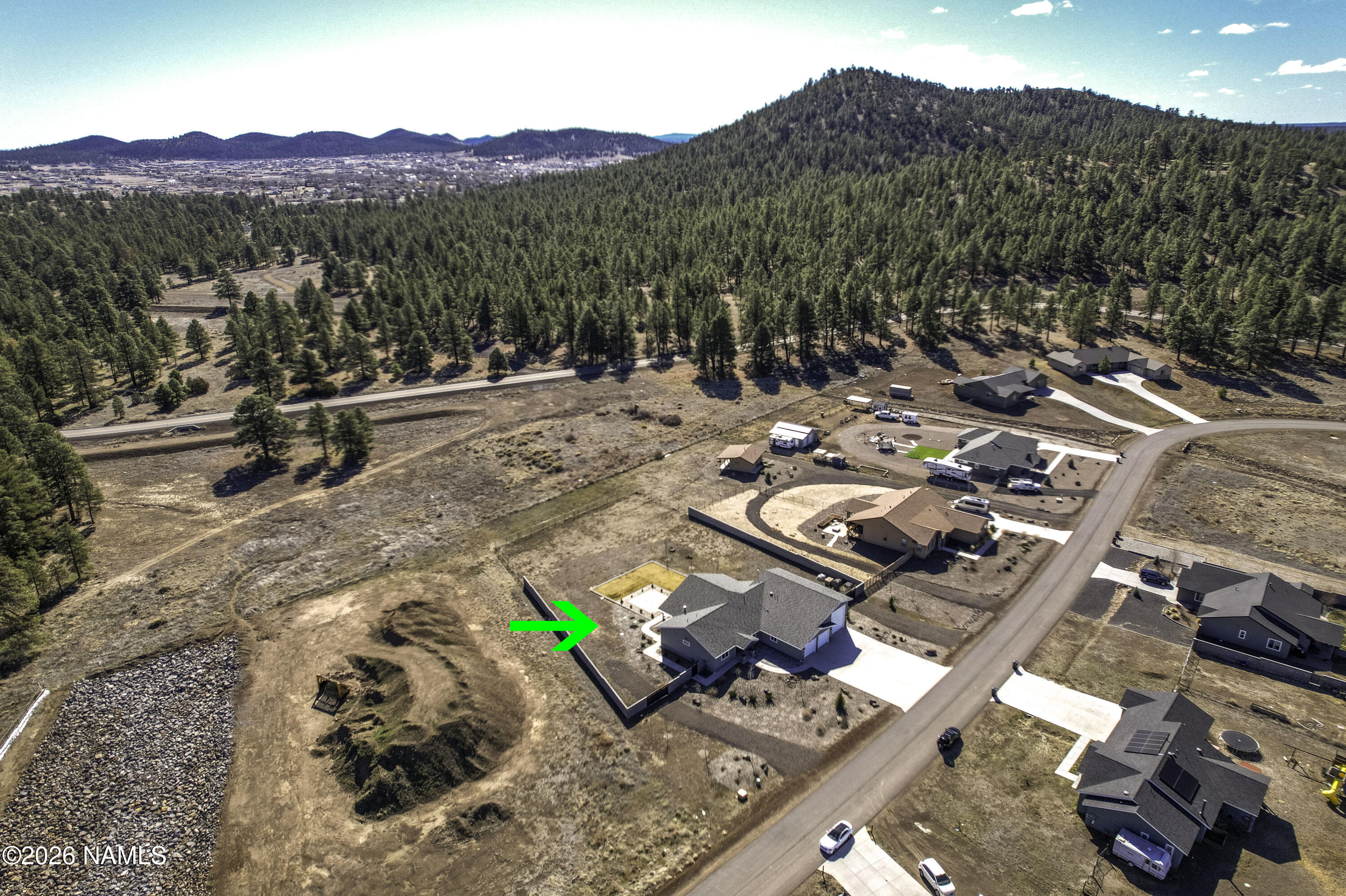 6560 Johnson Ranch Road Flagstaff, AZ 86004 - Photo 49 of 57 a view of a town with mountains in the background