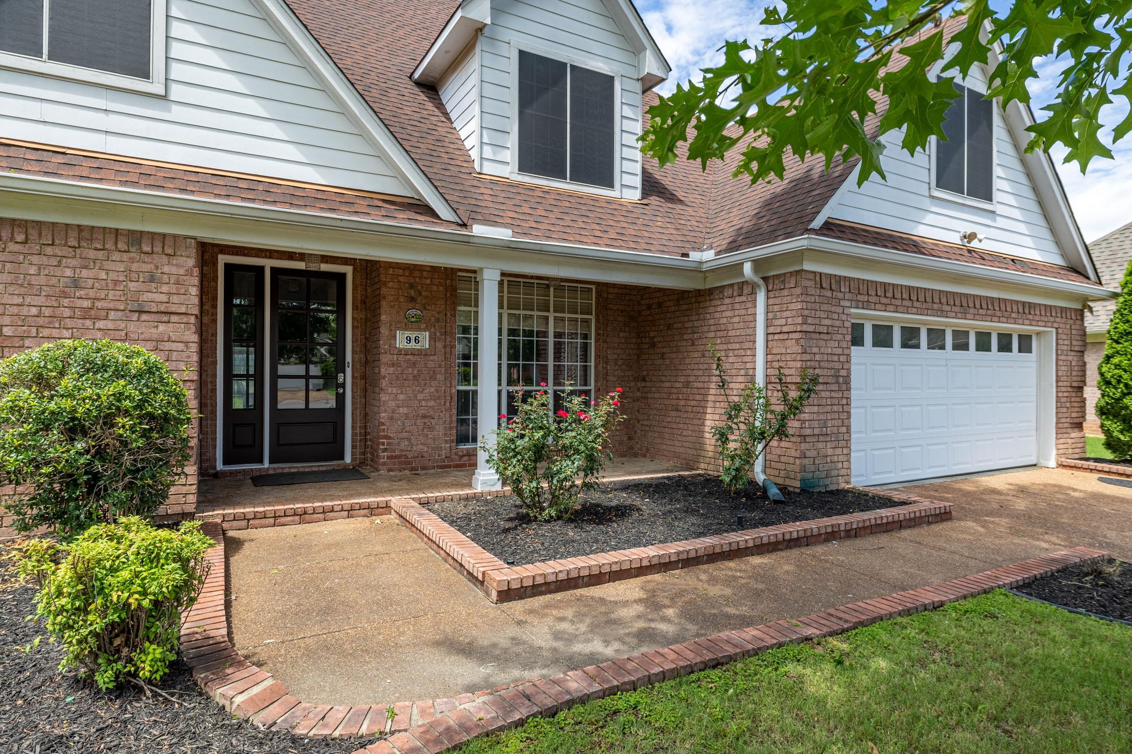 96 Berryfield Cove Collierville, TN 38017 - Photo 2 of 39 Brick exterior with white siding accents and a brown shingle roof
