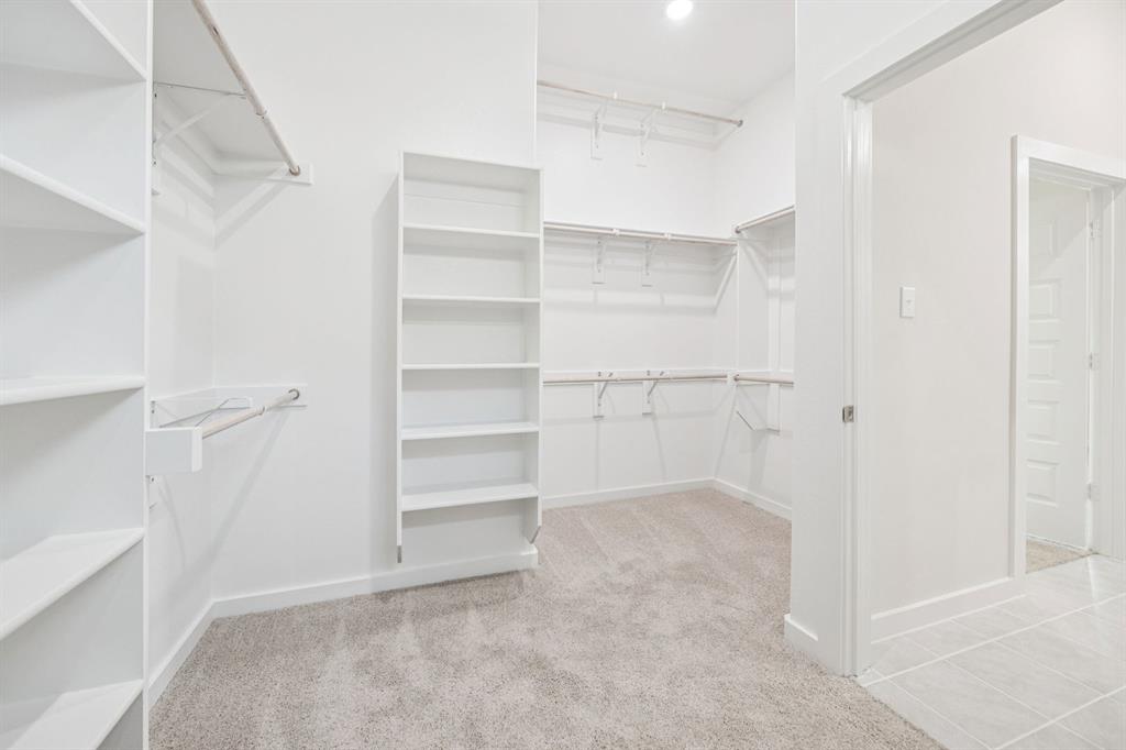 887 Sunflower Road Lavon, TX 75166 - Photo 17 of 28 Primary Closet in the Claret home plan by Trophy Signature Homes – REPRESENTATIVE PHOTO