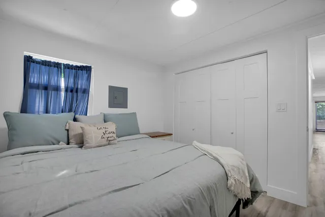 a bathroom with a sink toilet a mirror and shower