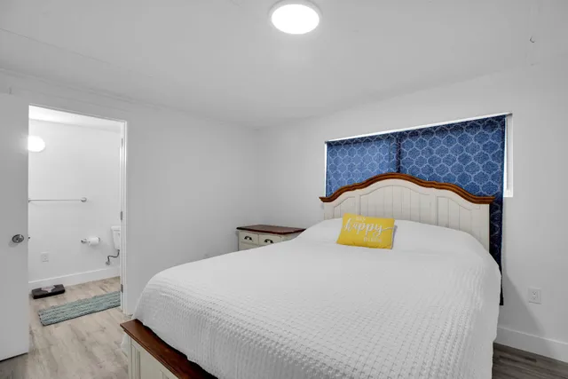 a bedroom with a bed and closet