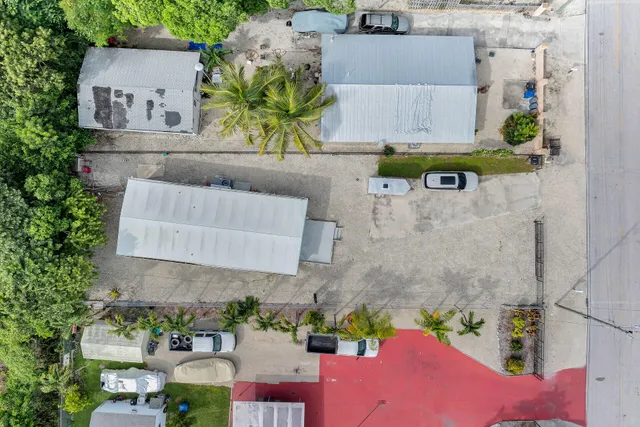an aerial view of a house with swimming pool and outdoor space