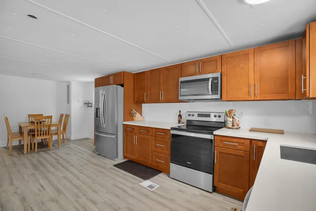 a view of a dining room with furniture and wooden floor