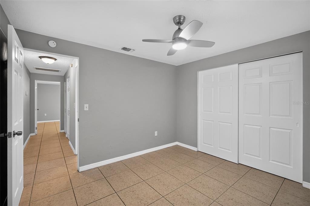3834 Warren Ridge Street Sarasota, FL 34233 - Photo 23 of 31 wooden floor in an empty room