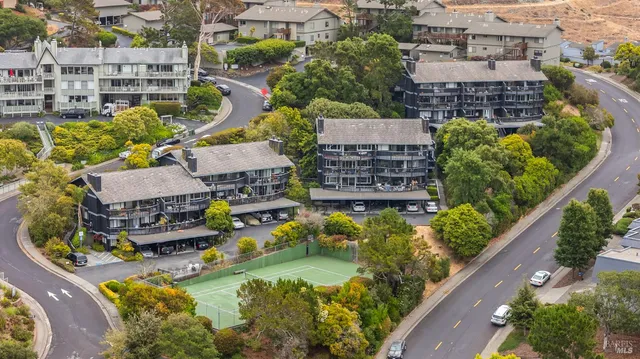 an aerial view of residential houses and outdoor space