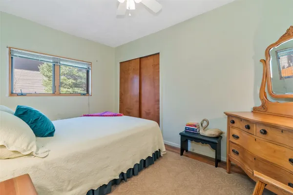 a bedroom with a bed and a dresser