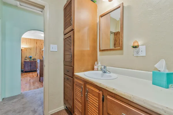 a bathroom with a sink and a mirror