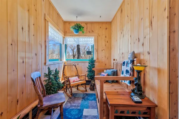 a dining room with furniture and wooden floor