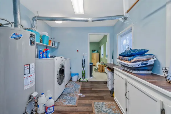a kitchen with a sink and a refrigerator