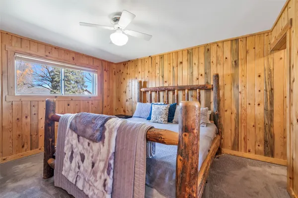 a en suite bathroom with a granite countertop tub and a sink