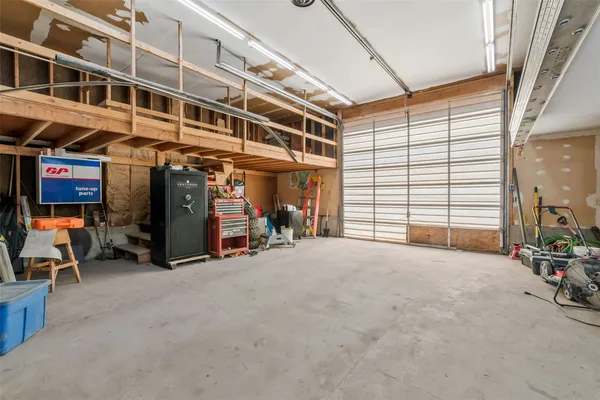 a view of a garage with cars