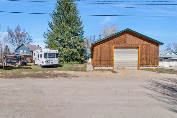 a view of a house with a snow in the yard