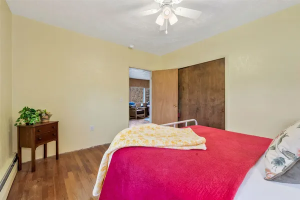 a bedroom with a bed and a chandelier