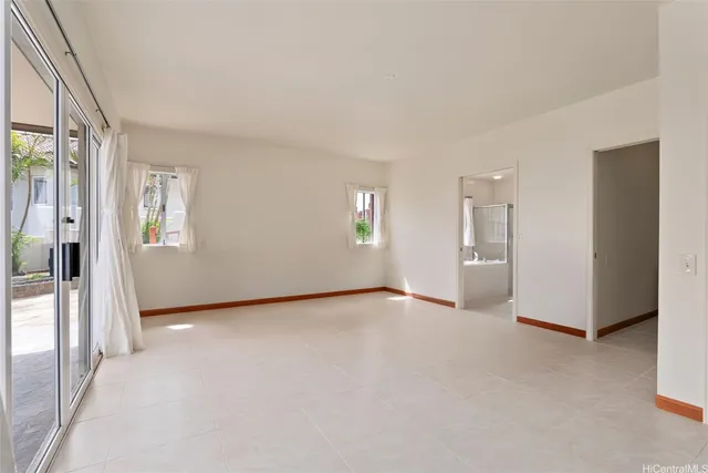 a view of an empty room and a window