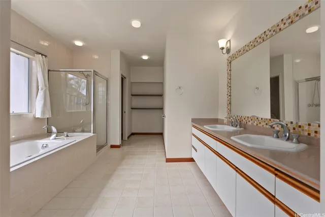 a bathroom with a double vanity sink mirror and double