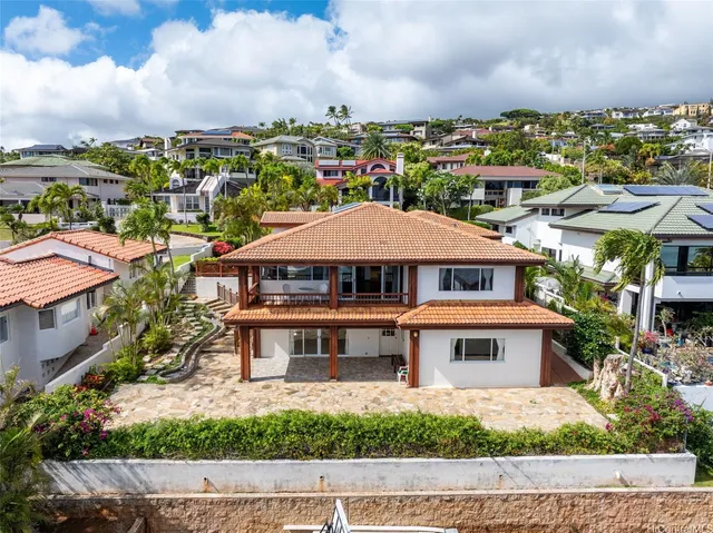 a aerial view of a house with a yard