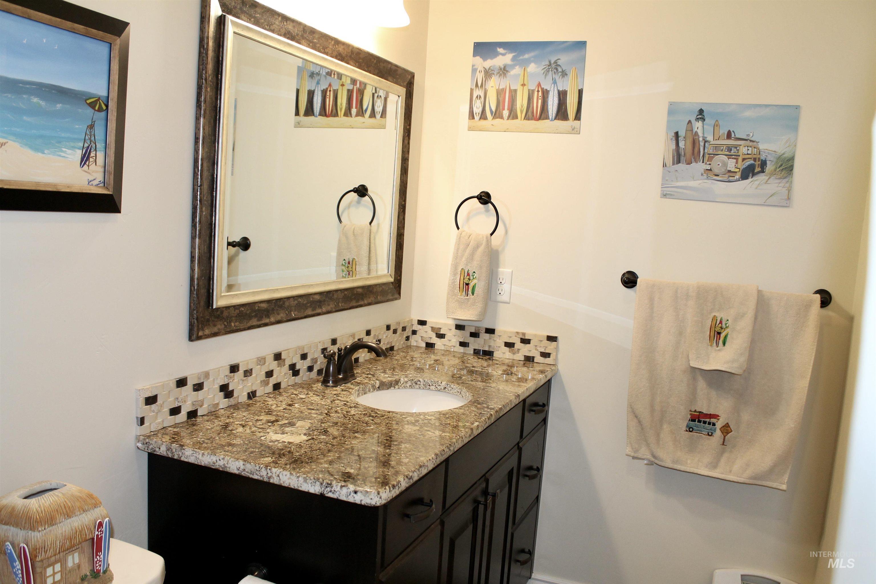2464 Windmill Drive Twin Falls, ID 83301 - Photo 29 of 47 Bathroom with vanity and tasteful backsplash
