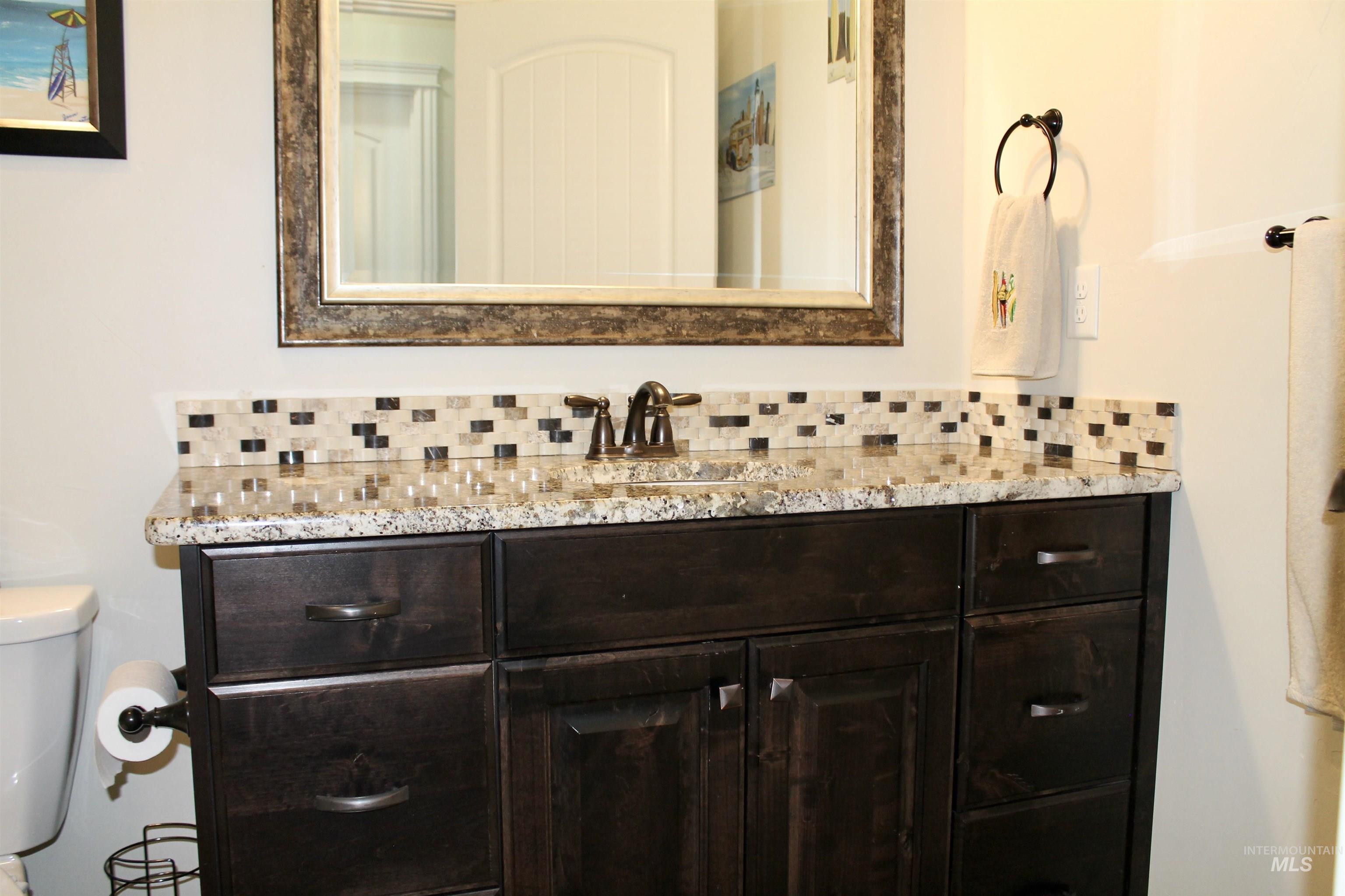 2464 Windmill Drive Twin Falls, ID 83301 - Photo 30 of 47 Bathroom featuring backsplash and vanity
