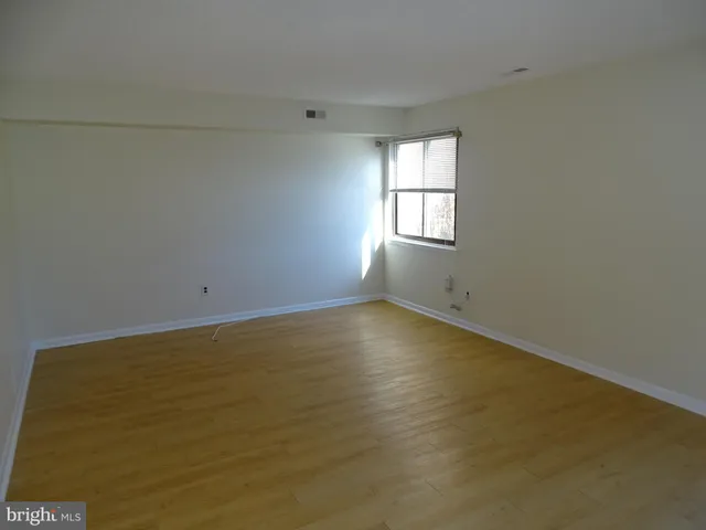 an empty room with a empty space and window