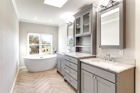 a bathroom with a granite countertop sink mirror and a
