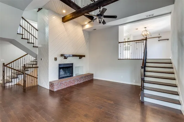 a view of an entryway with wooden floor