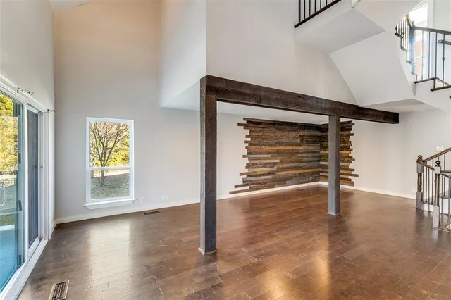 a view of a balcony with wooden floor