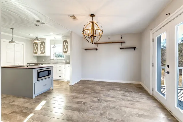 a bathroom with a granite countertop sink mirror and a