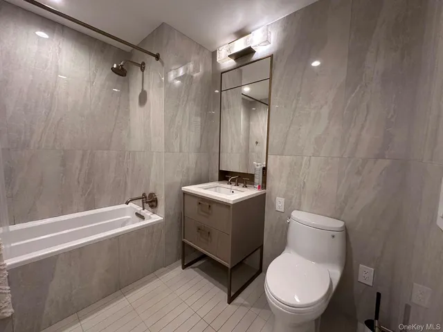 a view of a hallway with washer and dryer