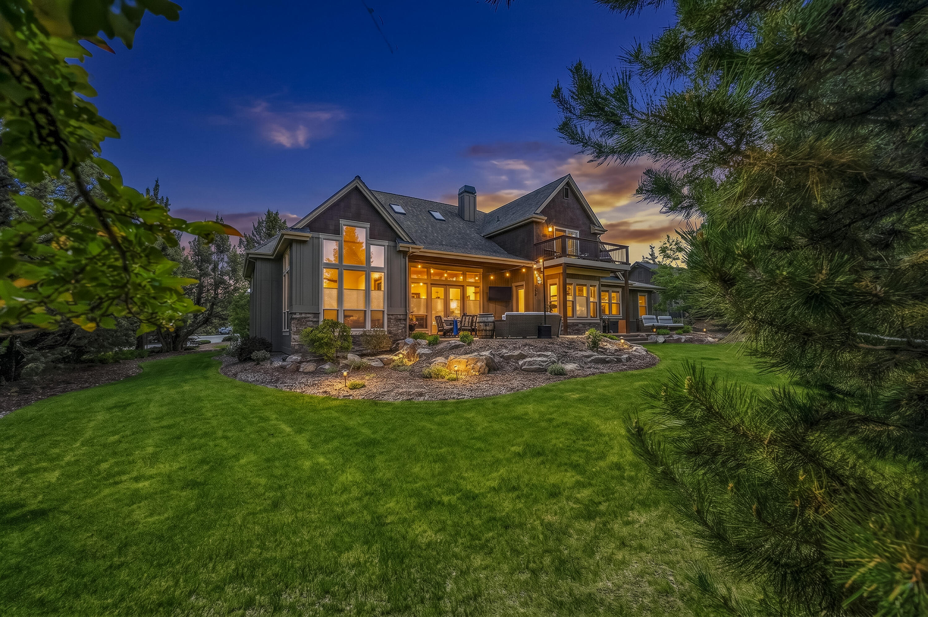 9009 Merlin Drive Redmond, OR 97756 - Photo 1 of 98 a front view of a house with yard and green space