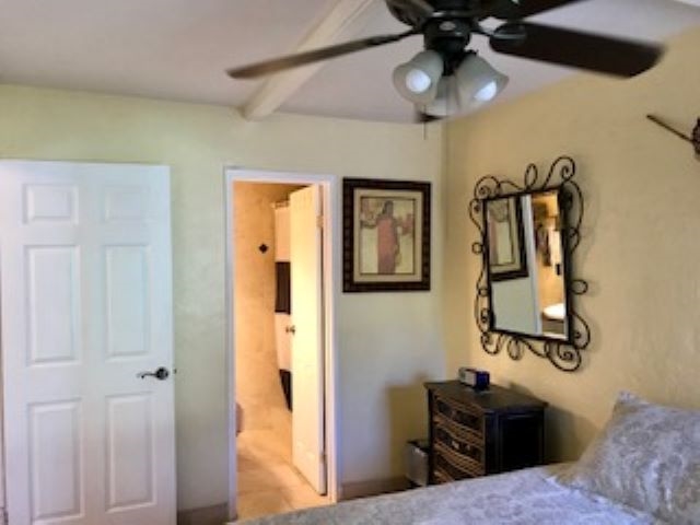 2037 South Kihei Road, Unit 1 Kihei, HI 96753 - Photo 11 of 16 a bedroom with a bed and cabinets