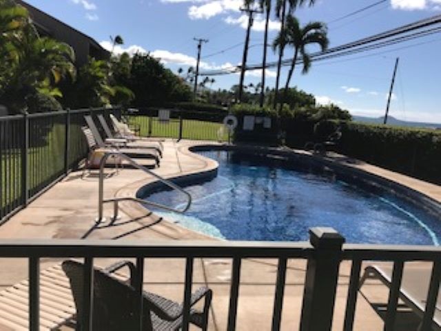 2037 South Kihei Road, Unit 1 Kihei, HI 96753 - Photo 14 of 16 a view of a chairs and table in the patio