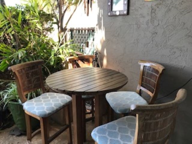 2037 South Kihei Road, Unit 1 Kihei, HI 96753 - Photo 4 of 16 a view of balcony with wooden floor and seating space