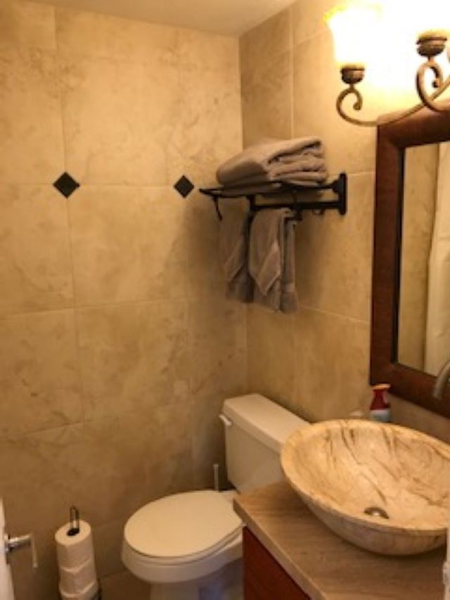 2037 South Kihei Road, Unit 1 Kihei, HI 96753 - Photo 8 of 16 a bathroom with a toilet and a sink