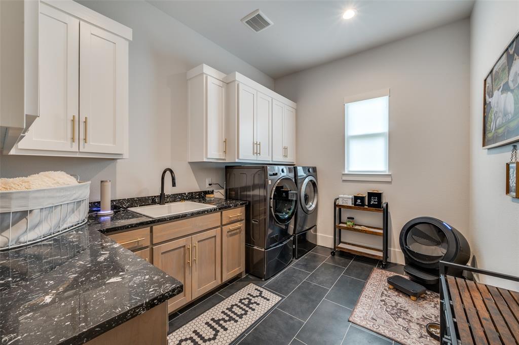 1459 Sunset Pt Drive Flower Mound, TX 75022 - Photo 24 of 38 a kitchen with a stove a sink and a window