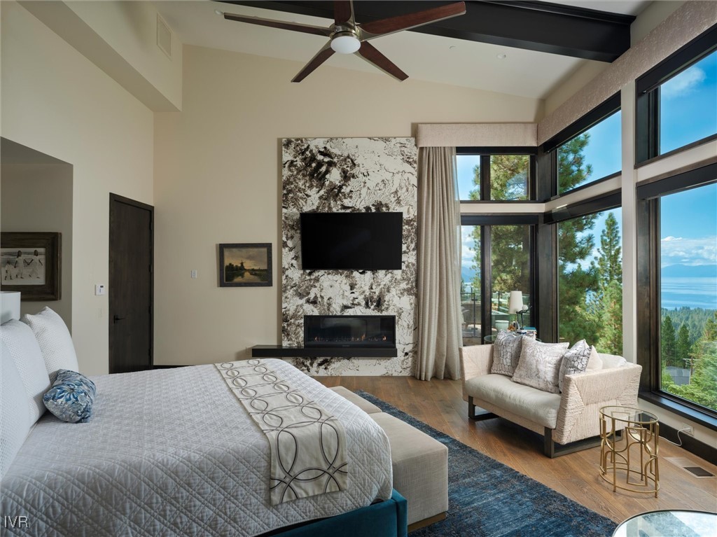 575 Fairview Boulevard Incline Village, NV 89451 - Photo 22 of 40 a bedroom with a large bed and a flat screen tv