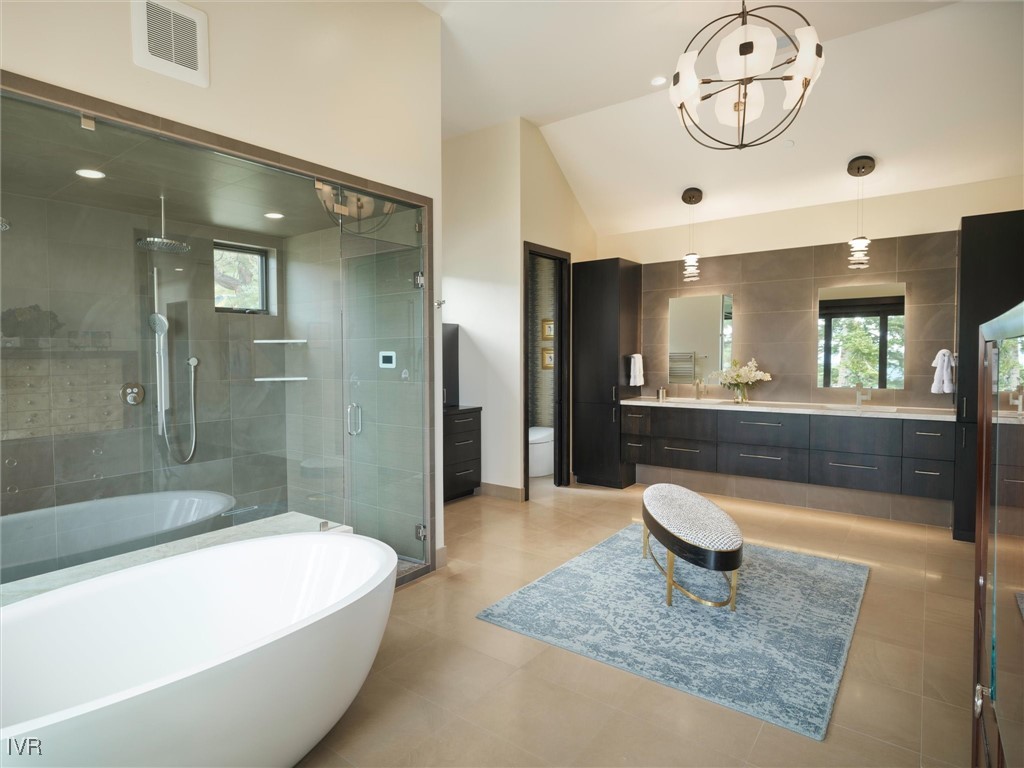 575 Fairview Boulevard Incline Village, NV 89451 - Photo 23 of 40 a spacious bathroom with a tub a mirror and shower