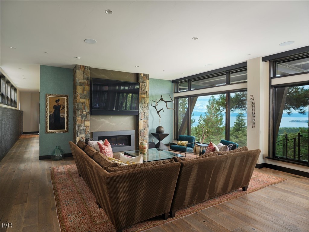 575 Fairview Boulevard Incline Village, NV 89451 - Photo 25 of 40 a living room with furniture large windows and a fireplace
