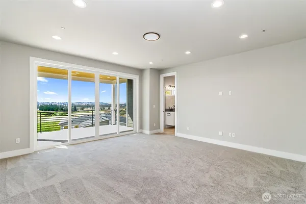 a view of an empty room with a sliding door