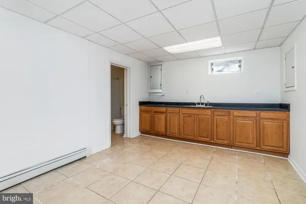 a view of a kitchen with cabinets