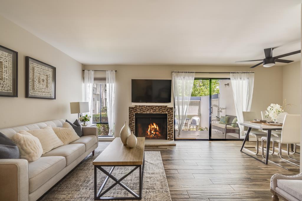 1091 Shell Boulevard, Unit 1 Foster City, CA 94404 - Photo 1 of 20 a living room with furniture wooden floor and a fireplace