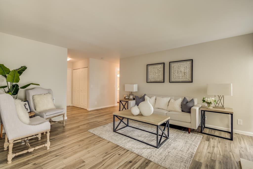 1091 Shell Boulevard, Unit 1 Foster City, CA 94404 - Photo 2 of 20 a living room with furniture and wooden floor