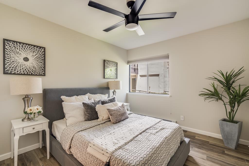 1091 Shell Boulevard, Unit 1 Foster City, CA 94404 - Photo 6 of 20 a bedroom with a large bed and a window
