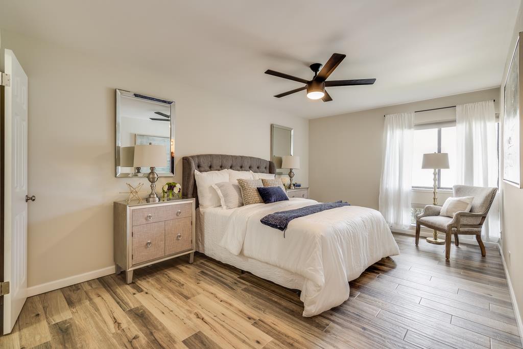 1091 Shell Boulevard, Unit 1 Foster City, CA 94404 - Photo 9 of 20 a bedroom with a bed and wooden floor