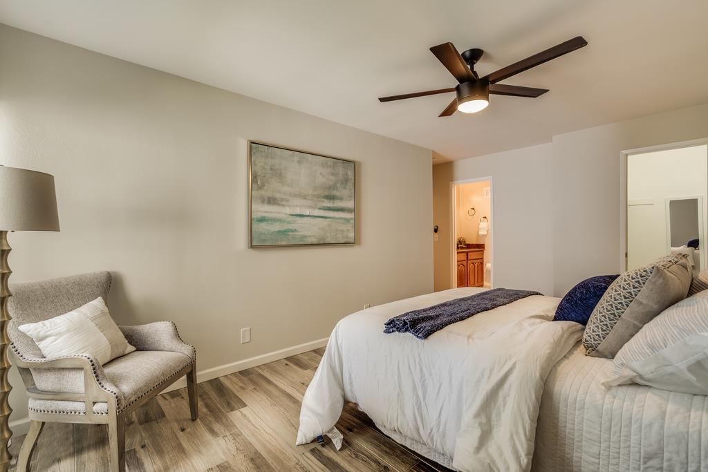 1091 Shell Boulevard, Unit 1 Foster City, CA 94404 - Photo 10 of 20 a bedroom with a large bed and a chair