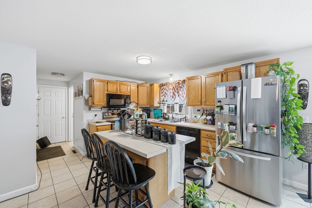 44 Border Street Springfield, MA 01104 - Photo 14 of 36 a view of a dining room with furniture window and wooden floor