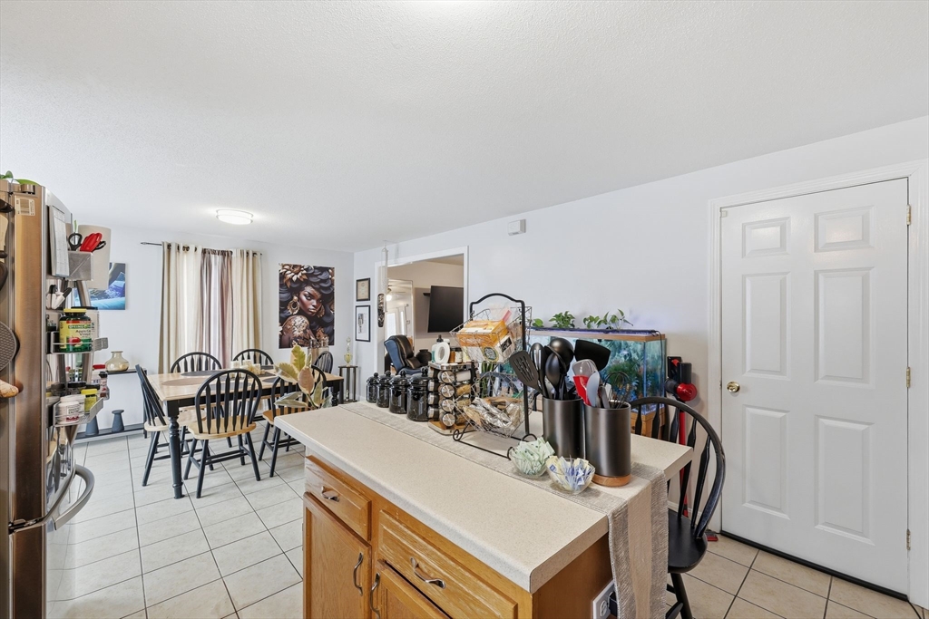 44 Border Street Springfield, MA 01104 - Photo 17 of 36 a view of a dining room with furniture and chandelier